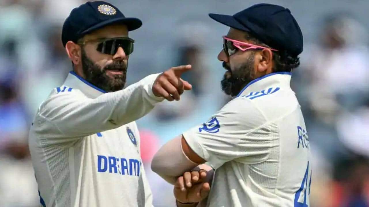 Rohit and Kohli chatting during a match